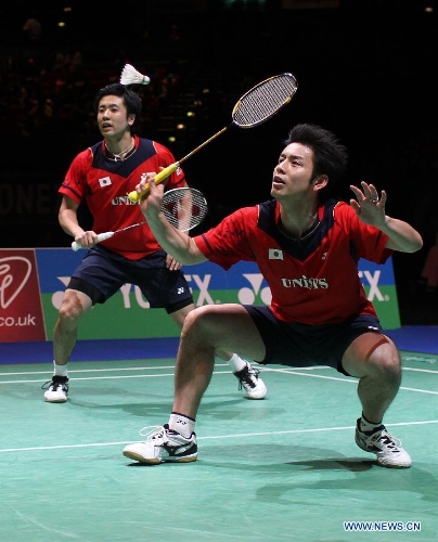 Japan's Hiroyuki Endo/Kenichi Hayakawa (R) compete during the men's doubles final against China's Liu Xiaolong/Qiu Zihan at the All England Open Badminton Championships in Birmingham, Britain, March 10, 2013. The Chinese pair won 2-0 to claim the title of the event.(Xinhua/Tang Shi) 