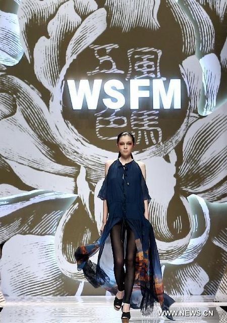 A model presents a creation in the Wei Lai S/S 2013 fashion show during the China Fashion Week held in Beijing, October 27, 2012. The fashion week, which attracted 51 designers from home and abroad, lasts from October 25 to November 3. Photo: Xinhua