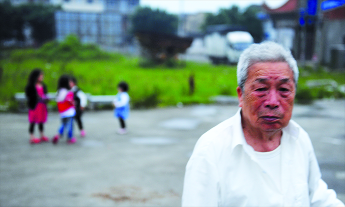 Cao Xiangdan, 91, is among the elderly residents who chose to stay behind instead of moving to a foreign country at an advanced age. Photo: CFP