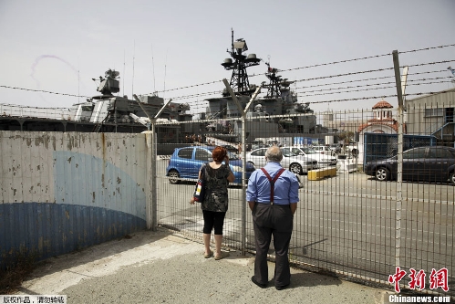 Russian sailors are seen aboad the Admiral Panteleyev Russian war ship moored at the Cypriot port of Limassol on Friday, May 17, 2013.&nbsp; (Photo Source: chinanews.com)