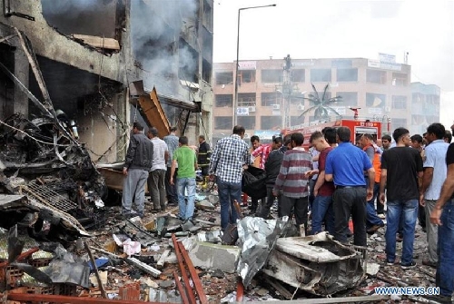 Photo taken on May 11, 2013 shows the site of an explosion in the town of Reyhanli, in the southern Turkish province of Hatay. At least 40 people were killed and 100 others injured after explosions shook a Turkish town on Saturday near the border with Syria, Turkish Interior Minister Muammer Guler said. (Xinhua/NTV) 