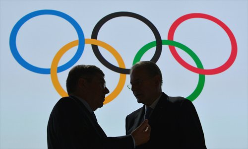 New International Olympic Committee (IOC) President Thomas Bach (left) talks with outgoing IOC President Jacques Rogge at the end of the 125th IOC session on Tuesday in Buenos Aires. Photo: IC