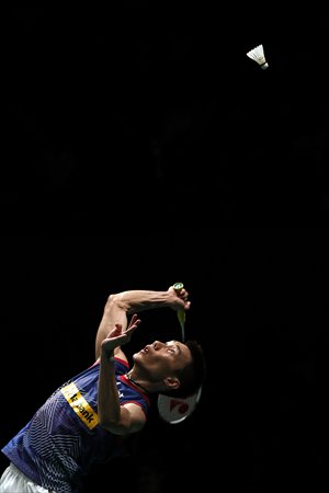 Malaysia's Lee Chong Wei returns a shot against Indonesia's Tommy Sugiarto during their men's singles final match at the BWF World Superseries Finals badminton competition in Kuala Lumpur on Sunday. Photo: IC