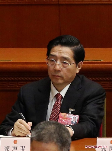   Guo Shengkun attends the sixth plenary meeting of the first session of the 12th National People's Congress (NPC) at the Great Hall of the People in Beijing, capital of China, March 16, 2013. Yang Jing, Chang Wanquan, Yang Jiechi, Guo Shengkun and Wang Yong were endorsed as state councilors of China at the meeting here on Saturday. (Xinhua/Jin Liwang)