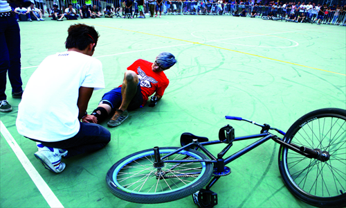 3. A participant treats a competitor who took a spill during one of the events. 

