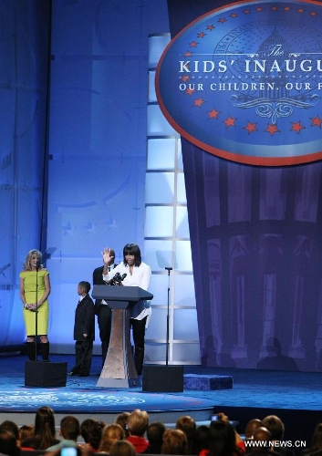 The First Lady Michelle Obama (R) speaks at the 
