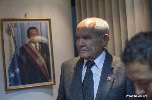 Venezuelan Ambassador to Guatemala Orlando Torrealba (L) reacts after the news of Venezuelan President Hugo Chavez's death was released, in Guatemala City, capital of Guatemala, on March 5, 2013. Venezuelan President Hugo Chavez died on March 5. (Xinhua/Luis Echeverria)