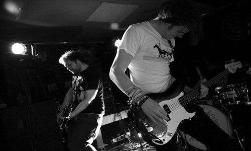 Maybeshewill bassist Jamie Wood rocking on tour, pre-injury. Photo: Courtesy of Carry Veto