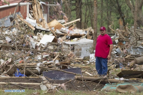A man is seen during the wreckage in Shawnee, Oklahoma, the United States, May 20, 2013. Two men were confirmed dead after tornadoes hit the U.S. state of Oklahoma, officials said Monday. Tornadoes ravaged portions of central Oklahoma on Sunday, according to media reports. (Xinhua/Marcus DiPaola) Related:Death toll from U.S. Oklahoma city tornado rises to 10HOUSTON, May 20 (Xinhua) -- The death toll from the tornado that hit the suburb of the U.S. city of Oklahoma Monday has risen to 10, as rescuers are still searching blocks of ruins for survivors, CNN reported.&nbsp; Full storyTornadoes hit U.S. state of Oklahoma, for second dayHOUSTON, May 20 (Xinhua) -- A tornado struck south of Oklahoma City on Monday afternoon, leveling blocks of homes and at least one elementary school, U.S. media reported.The tornado was estimated to be at least two miles wide at one point as it moved through Moore, Oklahoma, in the southern part of the Oklahoma City metropolitan area, according to CNN.&nbsp; Full story