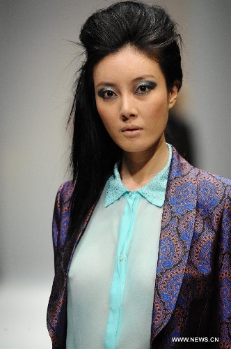 A model presents a creation of Dubai based label GisellaBlu's evening and party wear collection at the Audi Fashion Festival held in Singapore's Marina Bay, May 17, 2013. (Xinhua/Then Chih Wey) 