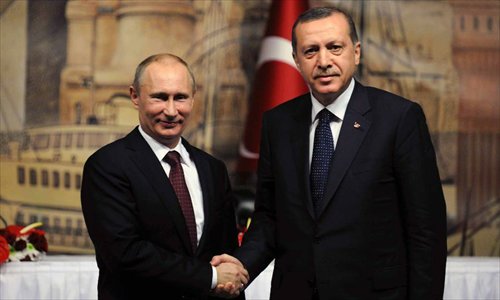 Turkish Prime Minister Recep Tayyip Erdogan (R) shakes hands with visiting Russian President Vladimir Putin after a joint press conference in Istanbul, Turkey, on December 3, 2012. Putin said here on Monday that Russia is not an advocate of the Syrian government. Photo: Xinhua