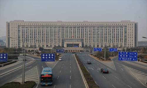 Cars pass in front of the office building in Jinan, Shandong Province which is the world's second largest office building. Photo: CFP