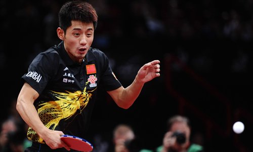 Olympic Champion Zhang Jike returns the ball to fellow Chinese Wang Hao during their World Table Tennis Championships men's singles final in Paris on Monday. Zhang won the match 11-7, 11-8, 6-11, 14-12, 5-11, 11-7. Earlier on Monday, China's Li Xiaoxia/Guo Yue defeated fellow Chinese Ding Ning/Liu Shiwen 5-11, 11-5, 11-7, 11-5, 11-7 to win the women's doubles title. Photo: CFP