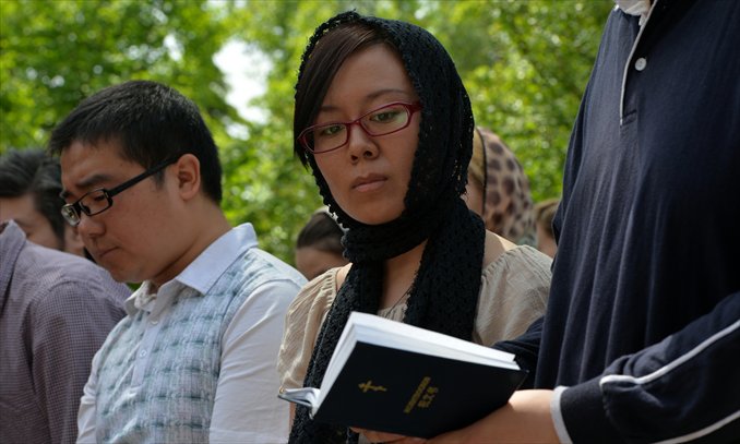 Chinese members of the congregation during a service conducted by Russian Orthodox Patriarch Kirill. Photo: AFP