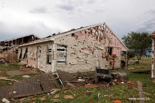 A destroyed house is seen in Moore, Oklahoma, May 21, 2013, one day after a tornado moved through the area. A powerful tornado attacked on Monday afternoon the southern suburbs of the Oklahoma City, capital of the U.S. state of Oklahoma, killing at least 24 people, including 9 children. (Xinhua/Song Qiong)
