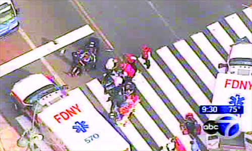 In this frame grab from WABC-TV, emergency personnel respond to reports of several people being shot outside the Empire State Building in New York on Friday. Authorities said two civilians were killed and the shooter was shot dead by the police. The New York Times said investigators have concluded that the shooting had no connection to terrorism and that it appeared to stem from a domestic dispute or a street robbery. Photo: AFP