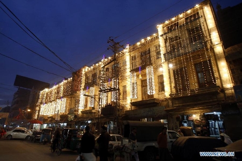 An illuminated building is seen during celebrations ahead of Eid-e-Milad-un-Nabi, marking the birth anniversary of the Islam's Prophet Mohammed, in northwest Pakistan's Peshawar on Jan. 24, 2013. (Xinhua Photo/Umar Qayyum) 