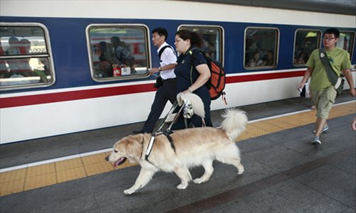 August 15, 2012, Ping Yali prepares to board the train.Photo:Li Hao/GT