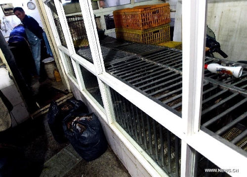 Photo taken on April 5, 2013 shows a cleaned poultry booth at a market on Jiangsu Road in Shanghai, east China. The government of Shanghai Municipality said on Friday sales of live poultry will be suspended in the municipality from April 6 as the H7N9 strain of avian influenza has sickened 14 people and killed six. (Xinhua/Chen Fei) 