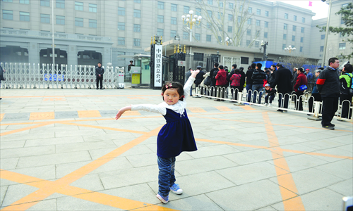 5. Zhang Zijing, a 4-and-a-half-year-old Beijinger, hams it up. She's already a big fan of trains. 
Photos: Li Hao/GT