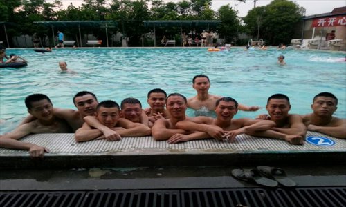 Sun Luoluo (far left) and colleagues exercise in a swimming pool. Photo: Courtesy of Shanghai Municipal Fire Bureau
