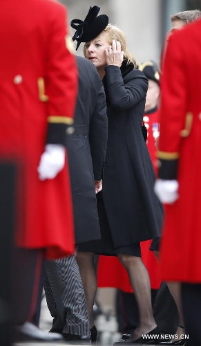 Carol Thatcher, the daughter of former British Prime Minister Margaret Thatcher, arrives for the funeral of former Baroness Thatcher, outside St. Paul's Cathedral in London, Britain, April 17, 2013. The funeral of Margaret Thatcher, the first female British prime minister, started 11 a.m. local time on Wednesday in London. (Xinhua/Wang Lili)