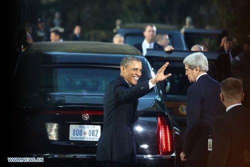 U.S. President Barack Obama waves as he leaves after a welcome ceremony held by Israeli President Shimon Peres (not in picture) at the president's residence in Jerusalem on Mar. 20 2013. Obama arrived in Israel on Wednesday, starting his first visit as U.S. president to the country. (Xinhua/POOL/Abir Sultan)