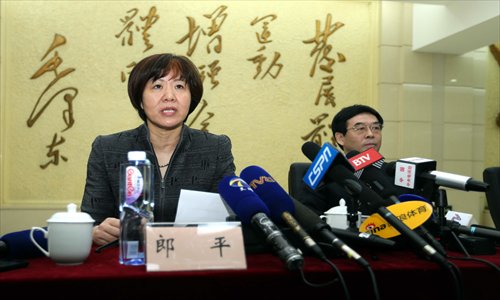 Lang Ping (left) speaks at the press conference held by the Chinese Volleyball Administrative Center which presented her as the new coach of the national women's team in Beijing on Thursday. Photo: CFP