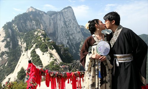 A couple celebrating the Qixi Festival in traditional hanfu. Photo: CFP