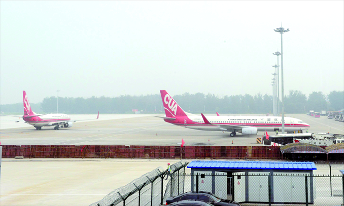 Airplanes park at Beijing Nanyuan Airport, which unveiled a new terminal on July 6 after a large-scale expansion and renovation that cost 350 million yuan. China United Airlines, the only commercial airline using Nanyuan, said the airport is now able to serve 6 million passengers a year, more than doubling its capacity. Photo: CFP
