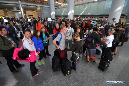 Passengers wait at San Francisco International Airport, the United States, July 6, 2013. The South Korean consulate has confirmed that the pair killed in a crash landing of an Asiana Airlines plane at San Francisco airport were women holding Chinese passports, the Chinese Consulate General in San Francisco told Xinhua Sunday. (Xinhua/Liu Yilin)
