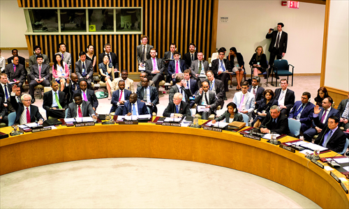 Russia (L) and China (R) cast a veto as members vote during a United Nations Security Council meeting on a resolution toward Syria. There were 11 votes in favor, Russia and China's votes against and two abstentions. Photo: AFP