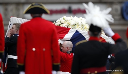 The coffin of British former prime minister Margaret Thatcher is carried into St. Paul's Cathedral in London, Britain, April 17, 2013. The funeral of Margaret Thatcher, the first female British prime minister, started 11 a.m. local time on Wednesday in London. (Xinhua/Wang Lili)