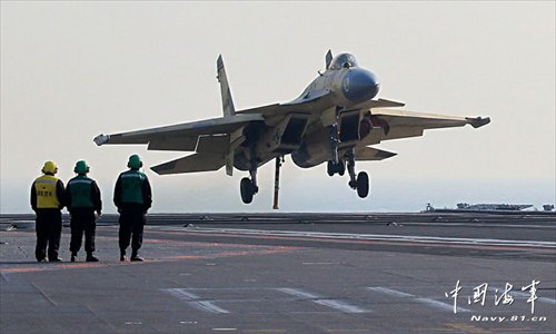 This undated photo shows a carrier-borne J-15 fighter jet ready to land on China's first aircraft carrier, the Liaoning. 