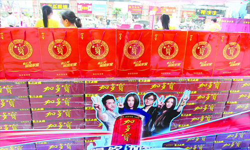 JDB products are seen with a sales promotion poster featuring the judges of popular music talent show 