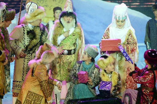 Actors perform in stage play Snowland Families in Altay, northwest China's Xinjiang Uygur Autonomous Region, Jan. 29, 2013. The stage play, created and performed by Altay Art Troupe, tells stories along the ancient Silk Road. (Xinhua/Sadat)