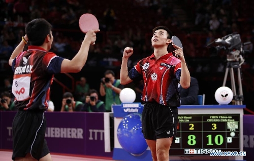 Chen Chien-An (R) and Chuang Chih-Yuan of Chinese Taipei celebrate during the final of men's doubles against Hao Shuai and Ma Lin of China at the 2013 World Table Tennis Championships in Paris, France on May 19, 2013. Chen and Chuang won 4-2. (Xinhua/Wang Lili) 