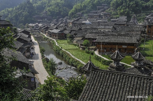 Photo taken on June 21, 2013 shows the Dimen Dong minority village in the morning in Liping County of southwest China's Guizhou Province. Dimen is a Dong minority village with about 2,500 villagers. It is protected properly and all the villagers could enjoy their peaceful and quiet rural life as they did in the past over 700 years. (Xinhua/Ou Dongqu)
