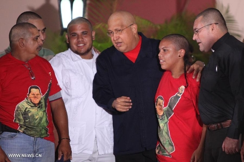  File photo taken on Aug. 21, 2011 shows Venezuelan President Hugo Chavez(C), with members of the group 