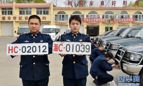 The military will adopt new military vehicle plates starting from May 1. Photo: Xinhua