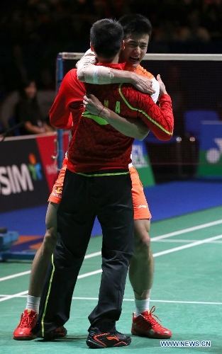 China's Chen Long(Back) celebrates after winning his men's singles final match against Malaysia's Lee Chong Wei at the 2013 Yonex All England Open Badminton Championships, in Birmingham, Britain, March 10, 2013. Chen Long won 2-0 to claim the titel.(Xinhua/Yin Gang)
