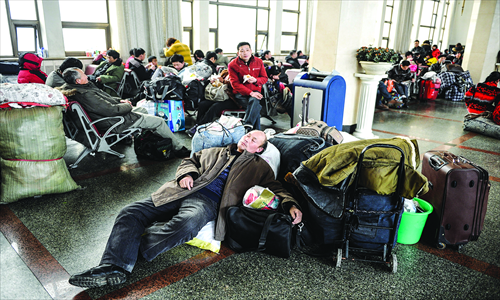3. The Beijing Railway Station is filled with people sleeping over to make sure they don't miss their trains home.
