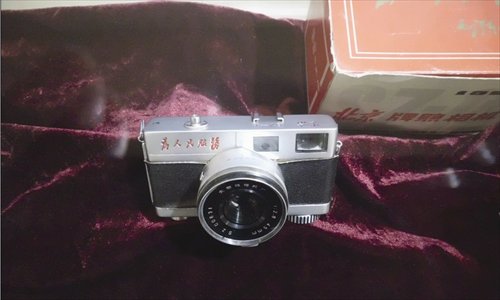 A Beijing Camera Factory model on display printed with the motto 