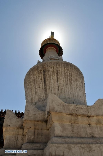 Photo taken on June 26, 2013 shows a white pagoda on Mount Wutai, one of four sacred Buddhist mountains in China, in north China's Shanxi Province. Added to UNESCO's World Heritage List in 2009, Mount Wutai is home to about 50 Buddhist temples built between the 1st century AD and the early 20th century. (Xinhua/Zhan Yan)