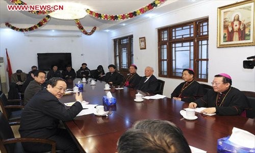 Yu Zhengsheng, a member of the Standing Committee of the Political Bureau of the Communist Party of China (CPC) Central Committee, visits Chinese Catholic Patriotic Association in Beijing, capital of China, January 21, 2013. Yu visited national religious groups in Beijing from January 21 to 23. (Xinhua/Rao Aimin)