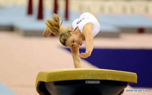 Giulia Steingruber of Switzerland competes during the women's vault final at the 6th FIG Artistic Gymnastics world Challenge Cup in Doha, Qatar, March 28, 2013. Steingruber took the bronze medal with 14.662 points. (Xinhua/Chen Shaojin) 