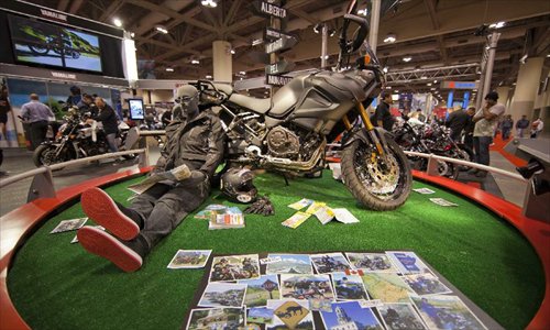 A motorcycle is on display during the 2012 Toronto Motorcycle Show at the Metro Toronto Convention Centre in Toronto, Canada, December 8, 2012. The three-day event displays hundreds of new 2013 motorcycles, scooters from the world's top manufacturers from December 7 to 9 this year. Photo: Xinhua
