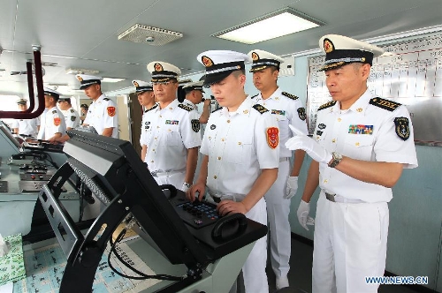 Officers and soldiers of Chinese navy operate on the destroyer Shenyang while departing from the port of Qingdao, east China's Shandong Province, July 1, 2013. A Chinese fleet consisting of seven naval vessels departed from east China's harbor city of Qingdao on Monday to participate in Sino-Russian joint naval drills scheduled for July 5 to 12. The eight-day maneuvers will focus on joint maritime air defense, joint escorts and marine search and rescue operations. (Xinhua/Zha Chunming)