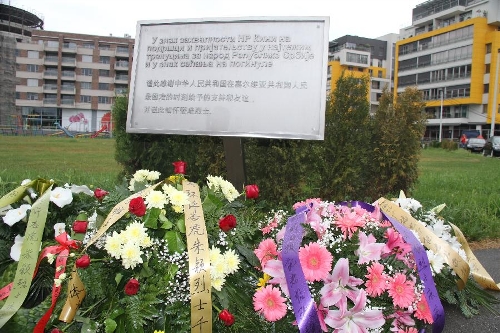 Photo taken on May 7, 2013 shows a monument to commemorate three Chinese journalists killed in the U.S.-led NATO bombing of the Chinese embassy in Belgrade. Shao Yunhuan of Xinhua News Agency along with Xu Xinghu and his wife Zhu Ying from the Beijing-based Guangming Daily newspaper were killed in the missile attack which inflicted serious damage to the embassy buildings on the evening of May 7, 1999. (Xinhua/Wang Hui) 