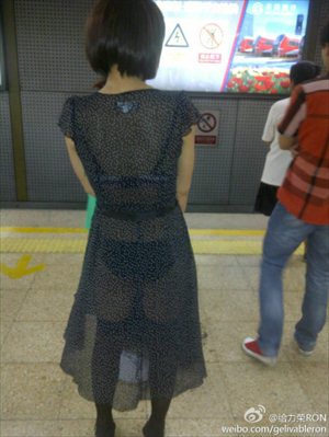 A protestor carries a sign that reads 